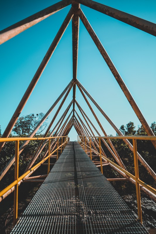 Structural steel walkway assembled by an industrial construction crew