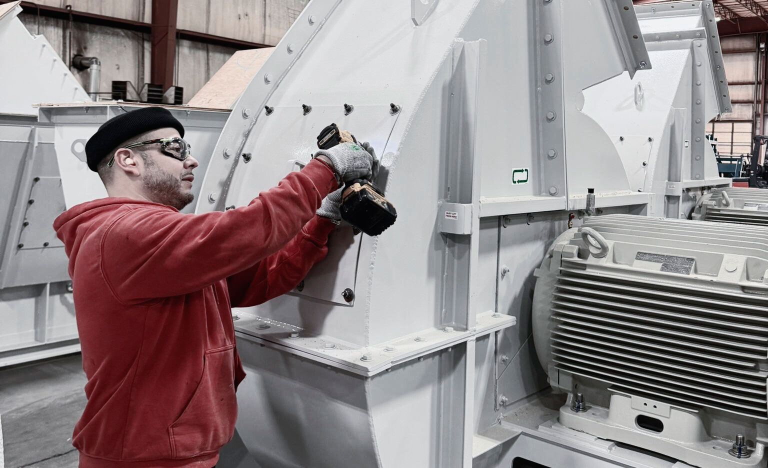 Millwright servicing a large industrial electric motor