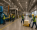 Industrial workers in Chattanooga manufacturing facility, operating machinery and handling materials, representing industrial hiring needs.