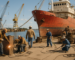 Shipbuilding staffing in Mobile Alabama, skilled trades working on a vessel by the waterfront.