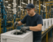 Skilled worker assembling appliance parts at a Michigan manufacturing facility near Benton Harbor