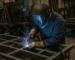 Welder working in a metal fabrication shop in Dayton and Rhea County