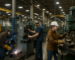 Skilled trades welders and machine operators working in an industrial plant in Mishawaka, Indiana